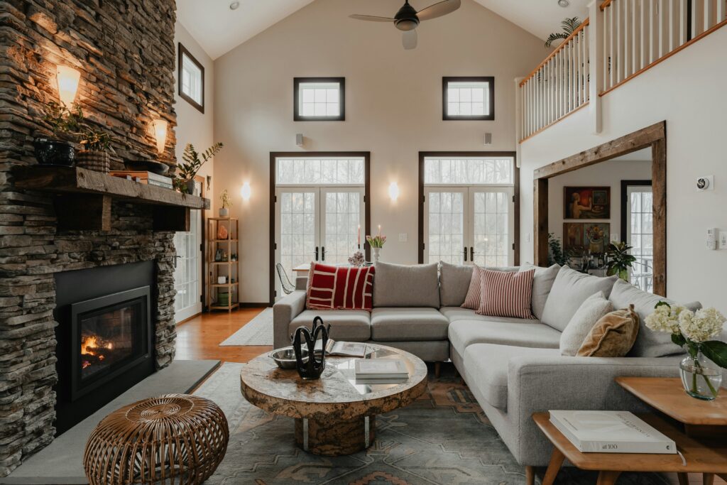 A cabin has a vaulted ceiling in the living room.